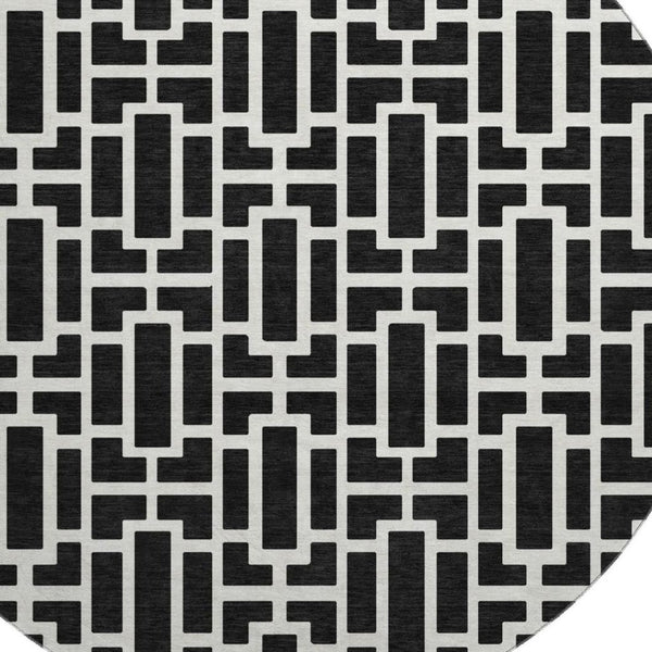 HomeRoots 8' Black And Ivory Geometric Round Rug - Washable, UV Protected, Durable, Modern Design for Any Space 672812