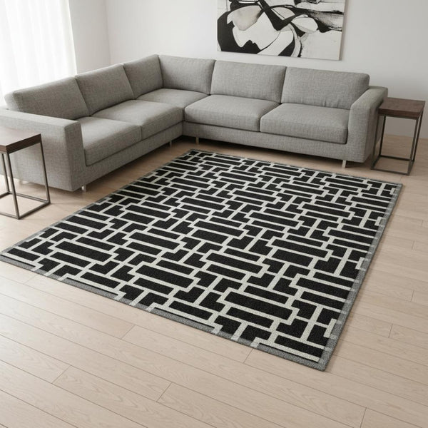 HomeRoots 8' X 10' Black and Ivory Geometric Area Rug - Stylish, Washable, UV-Protected for Modern Homes 672813