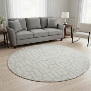 HomeRoots 8' Ivory and Beige Geometric Round Rug - Washable, UV Protected, Perfect for High-Traffic Areas 672830