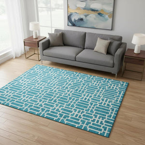 HomeRoots 5' X 8' Turquoise & Ivory Geometric Area Rug - Washable, UV Protected, Durable for Kids & Pets! 672859