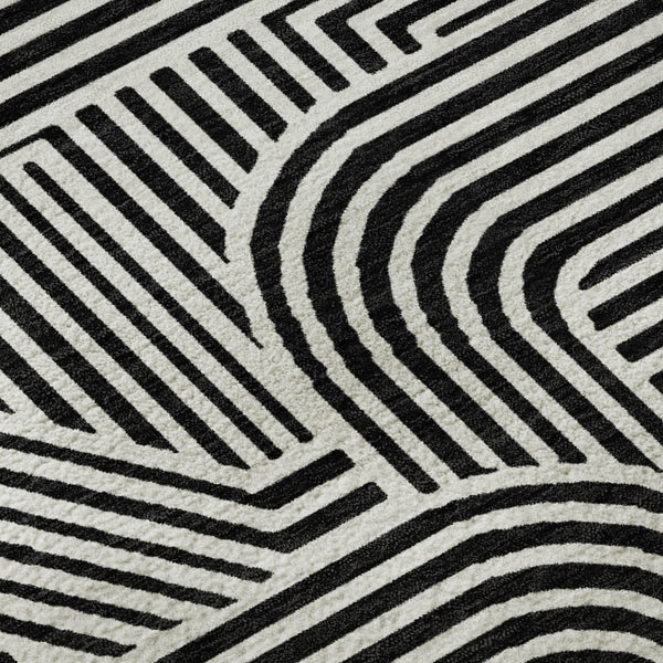 HomeRoots 8' Black And Ivory Abstract Geometric Round Rug – Durable, Washable, UV-Protected for Modern Homes 672884
