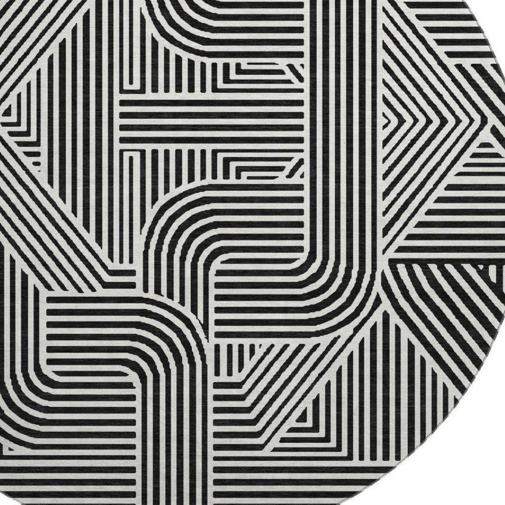 HomeRoots 8' Black And Ivory Abstract Geometric Round Rug – Durable, Washable, UV-Protected for Modern Homes 672884
