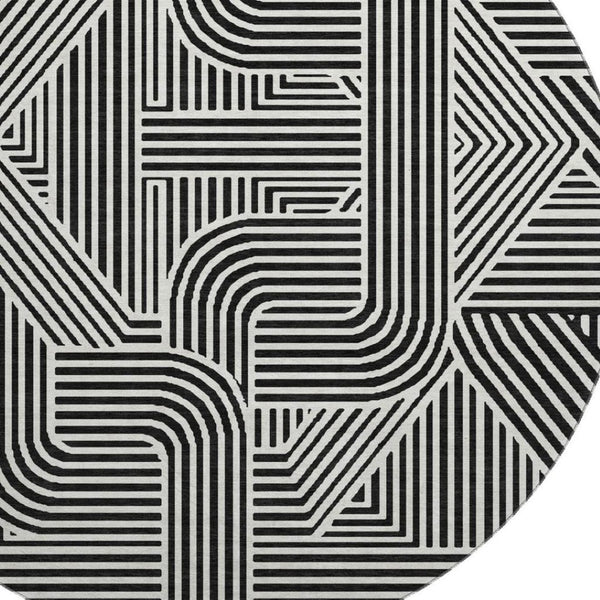 HomeRoots 8' Black And Ivory Abstract Geometric Round Rug – Durable, Washable, UV-Protected for Modern Homes 672884