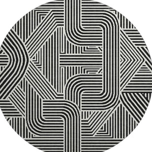 HomeRoots 8' Black And Ivory Abstract Geometric Round Rug – Durable, Washable, UV-Protected for Modern Homes 672884