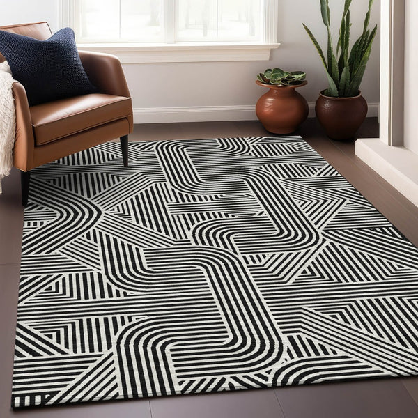 HomeRoots 8' X 10' Black And Ivory Abstract Geometric Area Rug - Washable, UV Protected & Ideal for High-Traffic Spaces 672885
