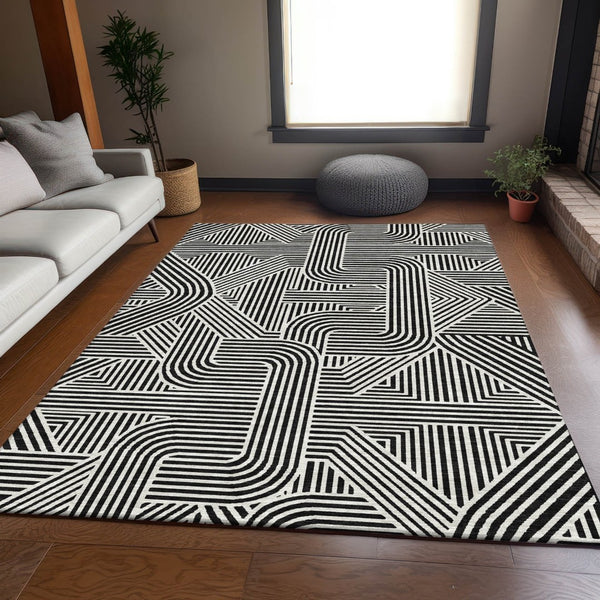 HomeRoots 8' X 10' Black And Ivory Abstract Geometric Area Rug - Washable, UV Protected & Ideal for High-Traffic Spaces 672885