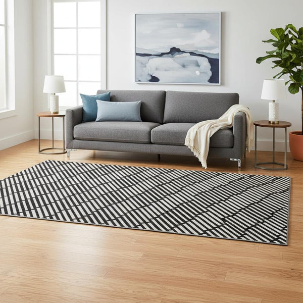 HomeRoots 5' X 8' Stylish Black and Gray Abstract Geometric Washable Rug - UV Protected & Stain Resistant! 672955