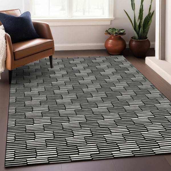 HomeRoots 10' X 14' Abstract Geometric Area Rug - Black & Gray, Washable, UV Protected for Modern Spaces 672959