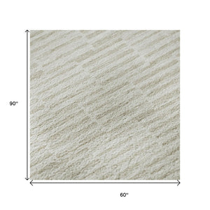 HomeRoots 5' X 8' Ivory And Beige Abstract Geometric Area Rug - Washable, UV Protected, Perfect for High Traffic! 672985