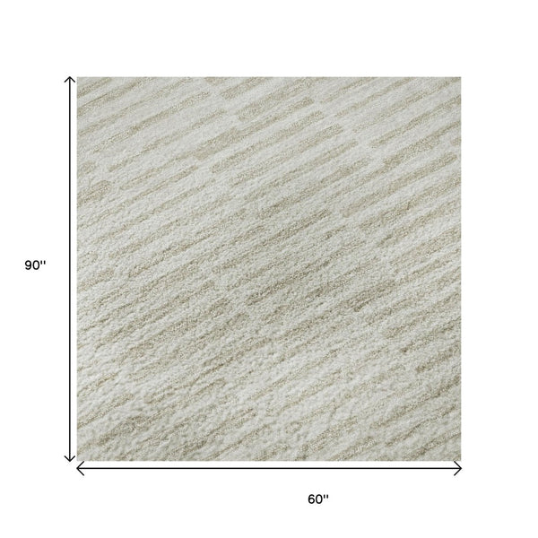 HomeRoots 5' X 8' Ivory And Beige Abstract Geometric Area Rug - Washable, UV Protected, Perfect for High Traffic! 672985