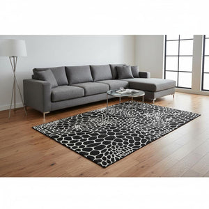 HomeRoots 9' X 12' Stylish Black and Ivory Geometric Area Rug - Washable, UV-Protected, Perfect for Families! 673036