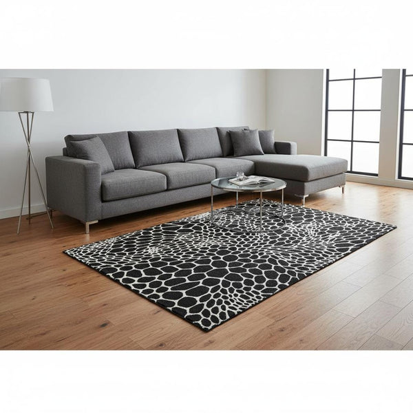 HomeRoots 9' X 12' Stylish Black and Ivory Geometric Area Rug - Washable, UV-Protected, Perfect for Families! 673036