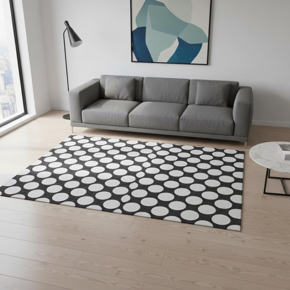 HomeRoots 5' X 8' Black And White Polka Dot Area Rug - Durable, Washable, UV Protected for Stylish Spaces 673185