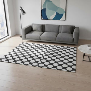 HomeRoots 5' X 8' Black And White Polka Dot Area Rug - Durable, Washable, UV Protected for Stylish Spaces 673185