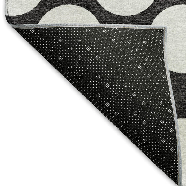 HomeRoots 5' X 8' Black And White Polka Dot Area Rug - Durable, Washable, UV Protected for Stylish Spaces 673185
