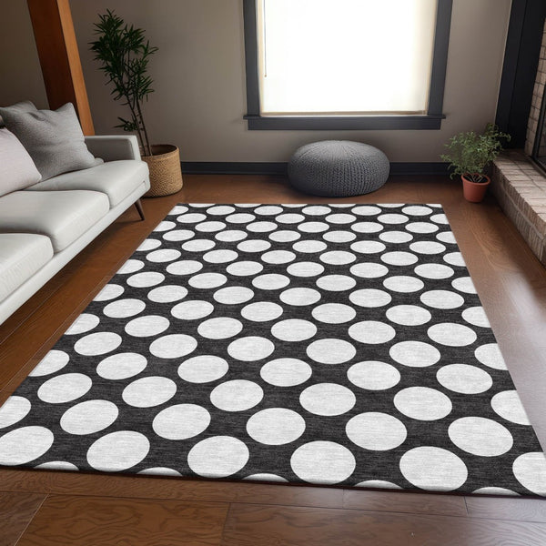 HomeRoots 5' X 8' Black And White Polka Dot Area Rug - Durable, Washable, UV Protected for Stylish Spaces 673185