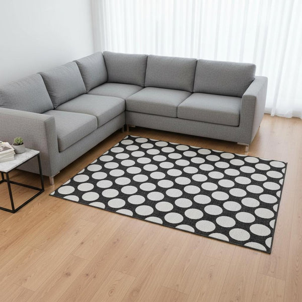 HomeRoots 9' X 12' Stylish Black and White Polka Dot Washable Area Rug with UV Protection for Busy Homes 673188