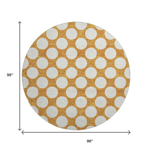 HomeRoots 8' Vibrant Orange and Ivory Polka Dot Washable Round Rug with UV Protection for High-Traffic Areas 673240