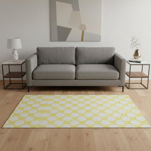 HomeRoots 5' X 8' Yellow and Ivory Polka Dot Area Rug - UV Protected, Washable, Kid & Pet Friendly Design! 673263
