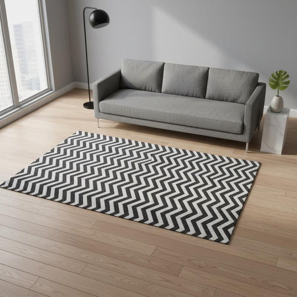 HomeRoots 5' X 8' Stylish Black and Ivory Chevron Washable Area Rug - Durable, UV-Protected, Pet-Friendly Design 673275