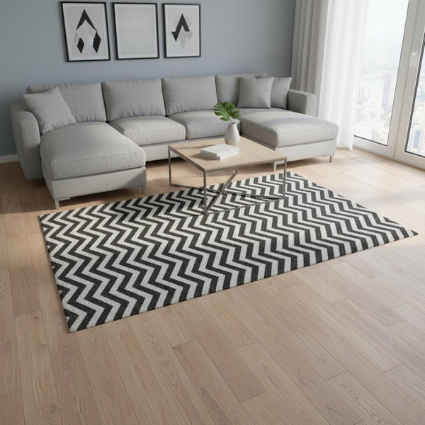 HomeRoots 9' X 12' Stylish Black and Ivory Chevron Washable Area Rug with UV Protection for Busy Homes 673278