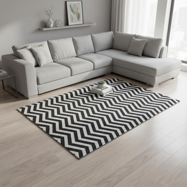HomeRoots 10' X 14' Black And Ivory Chevron Washable Area Rug - Stylish, Durable, UV-Protected for High-Traffic Spaces 673279