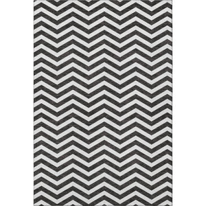 HomeRoots 10' X 14' Black And Ivory Chevron Washable Area Rug - Stylish, Durable, UV-Protected for High-Traffic Spaces 673279