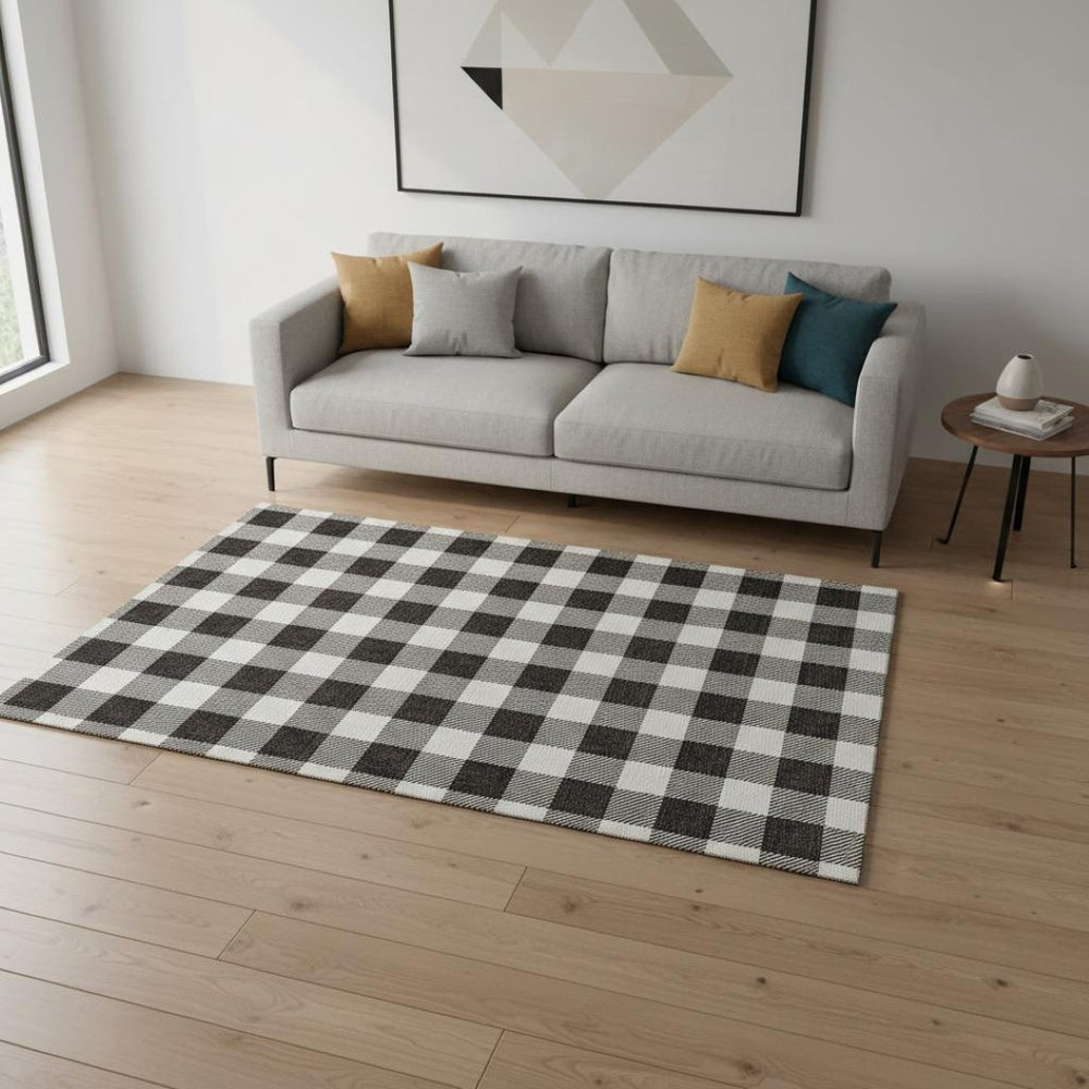 HomeRoots 5' X 8' Black and Ivory Plaid Washable Area Rug with UV Protection – Perfect for Homes with Kids & Pets! 673353