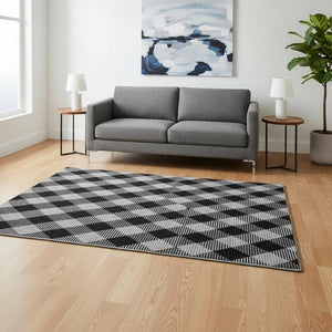 HomeRoots 5' X 8' Black and Ivory Plaid Area Rug – Washable, Stain-Resistant, UV Protected for Family Spaces 673443