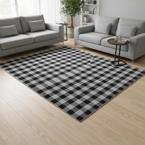 HomeRoots 8' X 10' Stylish Black and Ivory Plaid Washable Area Rug with UV Protection for High-Traffic Spaces 673445