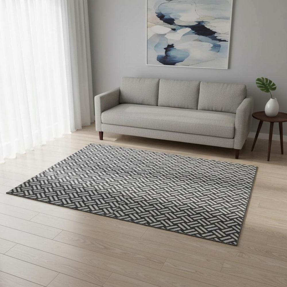 HomeRoots 5' X 8' Black And Ivory Abstract Geometric Area Rug - Washable, Stain Resistant, UV Protected Design 673503