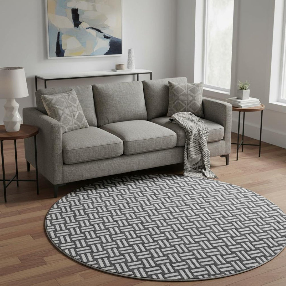 HomeRoots 8' Black And Ivory Abstract Geometric Round Rug – Washable, Stain-Resistant, UV Protected for Durability 673504
