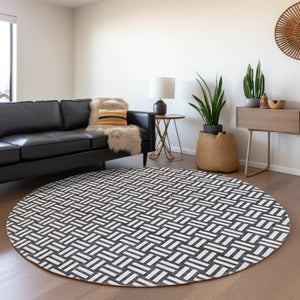 HomeRoots 8' Black And Ivory Abstract Geometric Round Rug – Washable, Stain-Resistant, UV Protected for Durability 673504