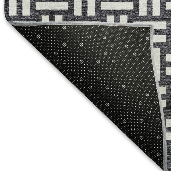 HomeRoots 8' Black And Ivory Abstract Geometric Round Rug – Washable, Stain-Resistant, UV Protected for Durability 673504