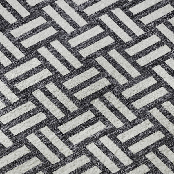 HomeRoots 8' Black And Ivory Abstract Geometric Round Rug – Washable, Stain-Resistant, UV Protected for Durability 673504