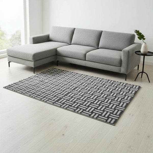 HomeRoots 10' X 14' Black and Ivory Geometric Area Rug - Washable, UV-Protected, Perfect for Busy Homes! 673507