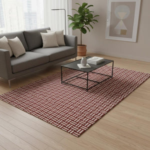 HomeRoots 5' X 8' Abstract Geometric Red and Ivory Washable Area Rug with UV Protection for Easy Care 673575