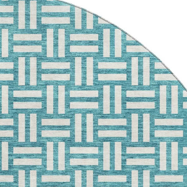 HomeRoots 8' Teal and Ivory Abstract Geometric Round Rug - Washable, UV Protected, Perfect for High Traffic Spaces 673588