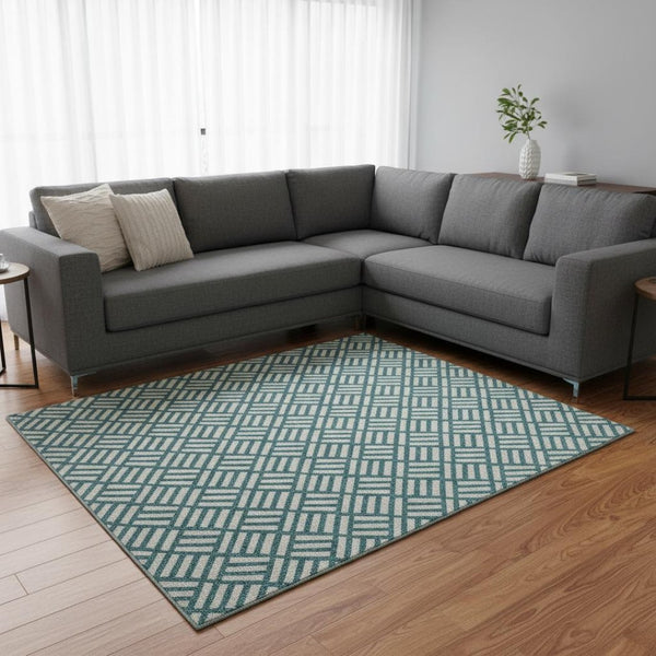 HomeRoots 8' X 10' Teal and Ivory Geometric Washable Area Rug with UV Protection for Stylish Everyday Living 673589