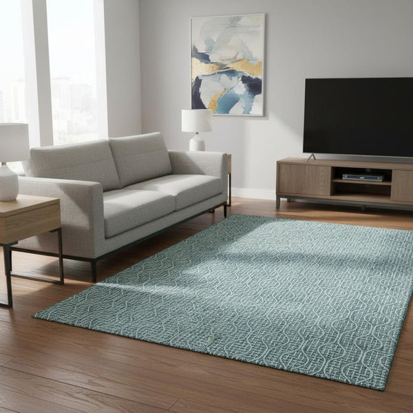 HomeRoots 5' X 8' Teal and Ivory Geometric Area Rug – Stylish, Washable, UV-Protected for High-Traffic Spaces! 673671