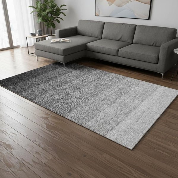 HomeRoots 9' X 12' Stylish Black and Gray Ombre Washable Area Rug with UV Protection for Modern Homes 673770