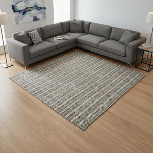 HomeRoots 8' X 10' Taupe and Ivory Striped Washable Area Rug with UV Protection for High-Traffic Spaces 673889