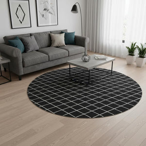 HomeRoots 8' Black and Ivory Geometric Round Rug - Washable, UV-Protected, Stain-Resistant for Modern Spaces 674062