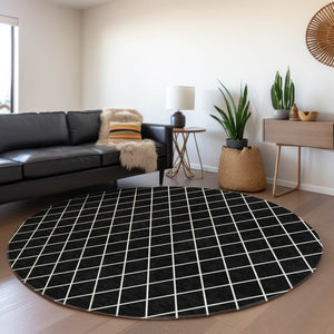 HomeRoots 8' Black and Ivory Geometric Round Rug - Washable, UV-Protected, Stain-Resistant for Modern Spaces 674062