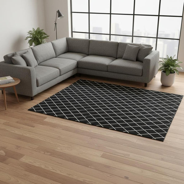 HomeRoots 8' X 10' Black And Ivory Geometric Area Rug - Washable, UV Protected, Perfect for Modern Spaces! 674063