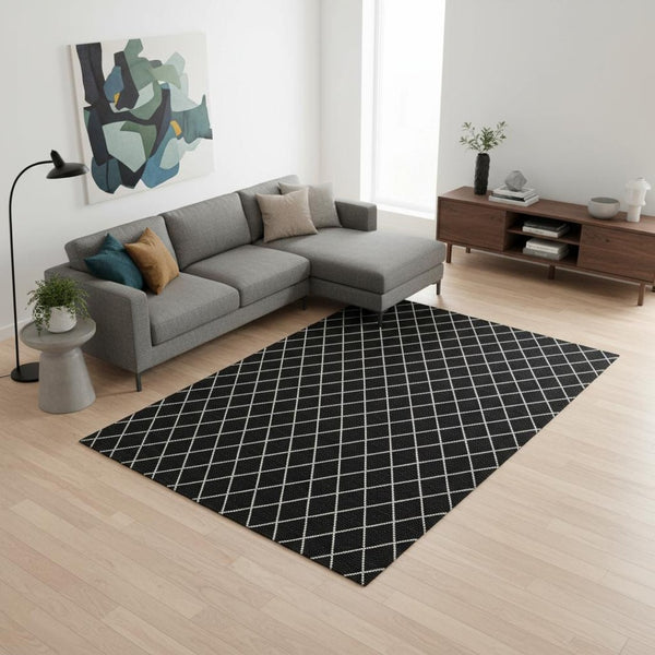 HomeRoots 10' X 14' Stylish Black and Ivory Geometric Washable Area Rug with UV Protection for Modern Living 674065