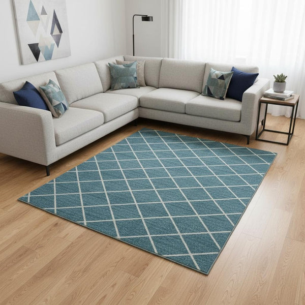 HomeRoots 10' Teal and Ivory Geometric Washable Area Rug with UV Protection for Stylish, High-Traffic Spaces 674131
