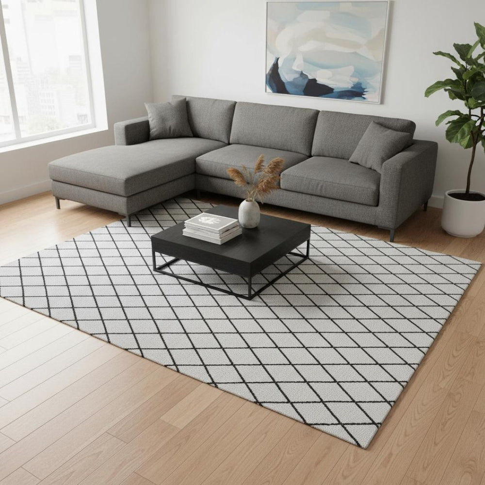 HomeRoots 9' X 12' Modern Black and White Geometric Washable Area Rug with UV Protection for Family Spaces 674136