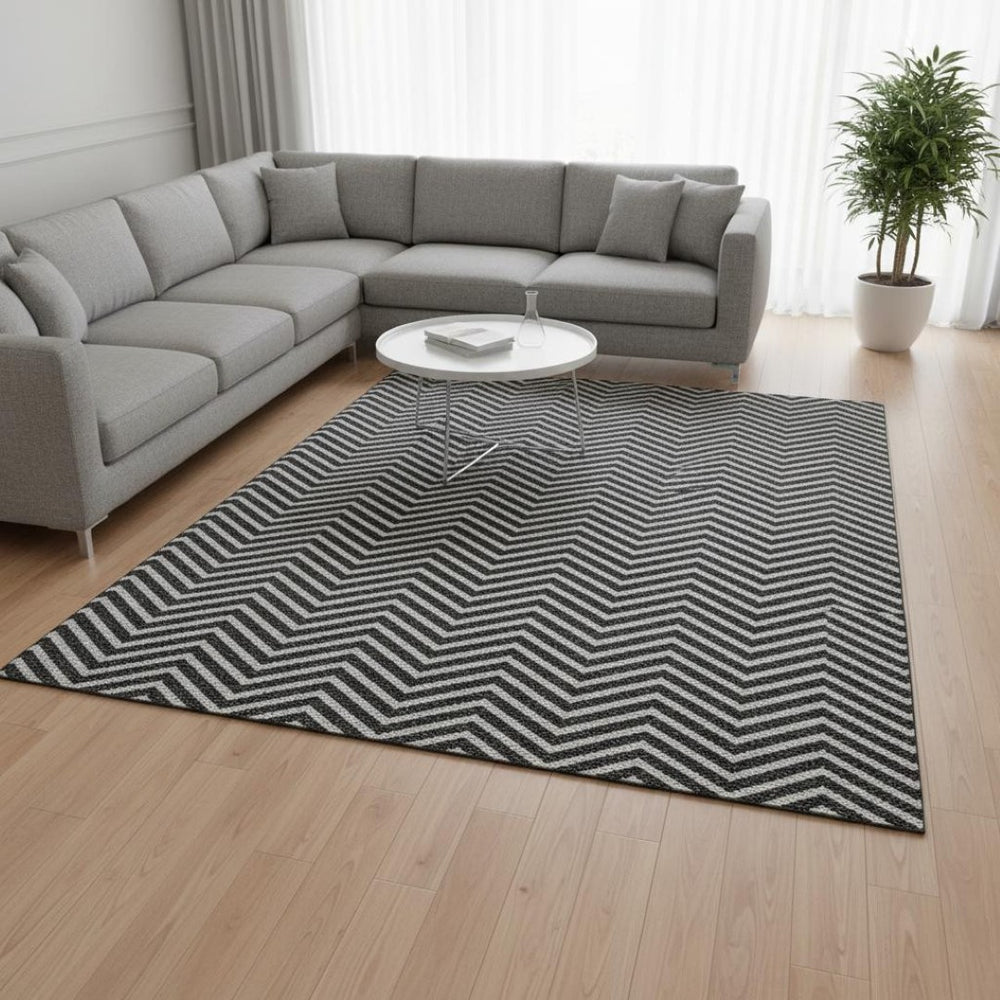 HomeRoots 9' X 12' Black And Ivory Chevron Area Rug - Stylish, Washable, UV-Protected Design for High-Traffic Areas 674226