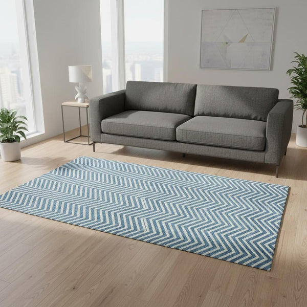 HomeRoots 5' X 8' Teal Chevron Area Rug - Washable, UV Protected, Durable Design for High-Traffic Family Spaces 674271